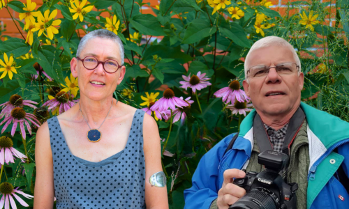 Photo of Lorraine Johnson and Rick Gray with flowers in the background